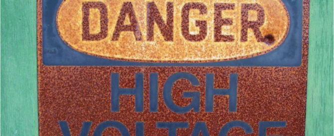 rusty danger high voltage sign