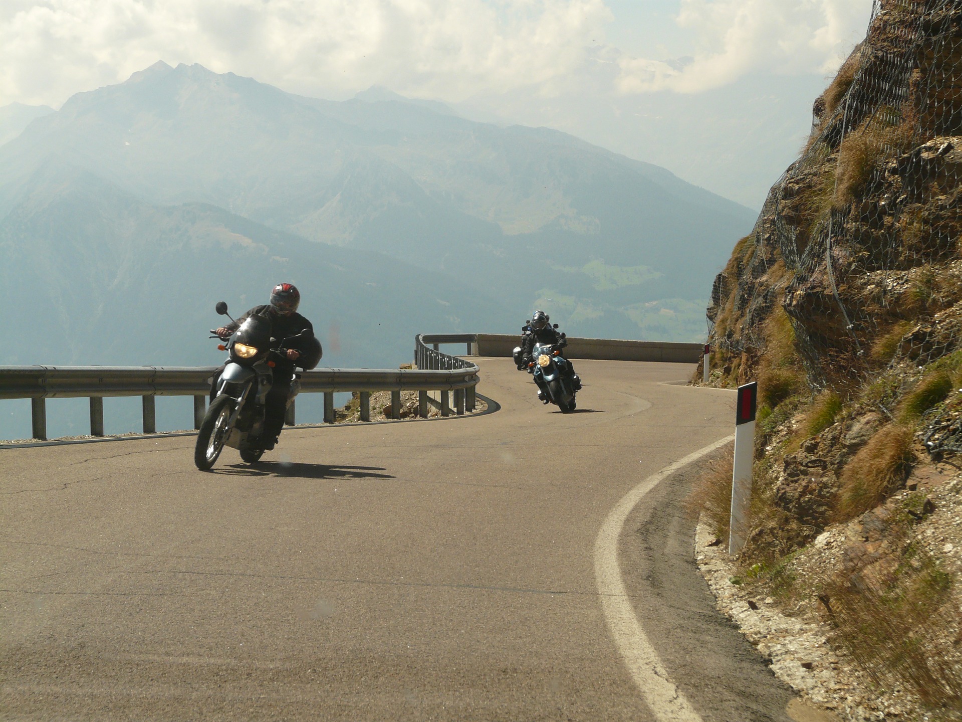 two motorcycles on a winding mountain road