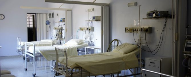 a row of empty hospital beds